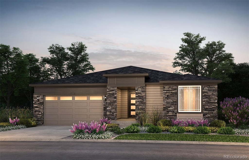 prairie-style house featuring a garage