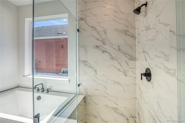 full bathroom with a bath and a marble finish shower