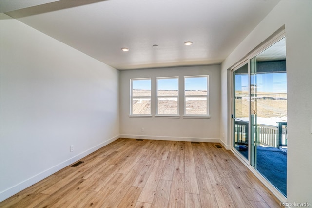 spare room featuring recessed lighting, baseboards, visible vents, and light wood finished floors