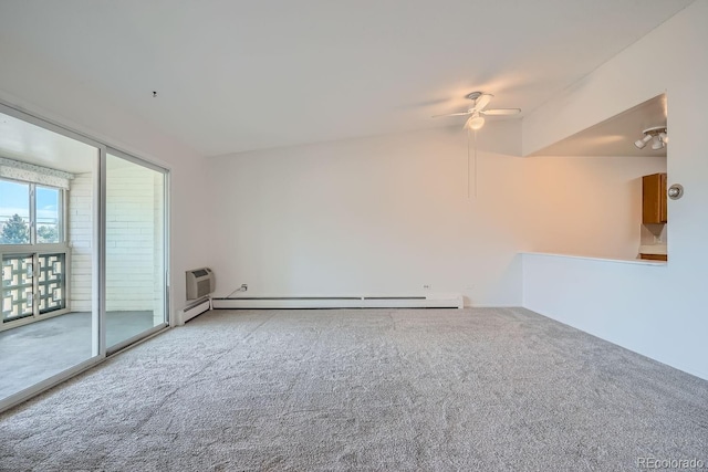 spare room featuring ceiling fan, light colored carpet, a baseboard heating unit, vaulted ceiling, and a wall mounted AC