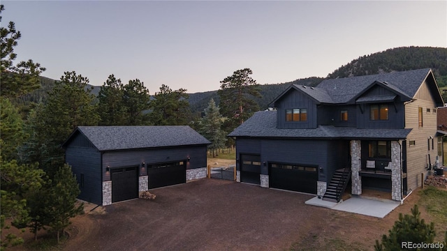 exterior space featuring a garage and a mountain view