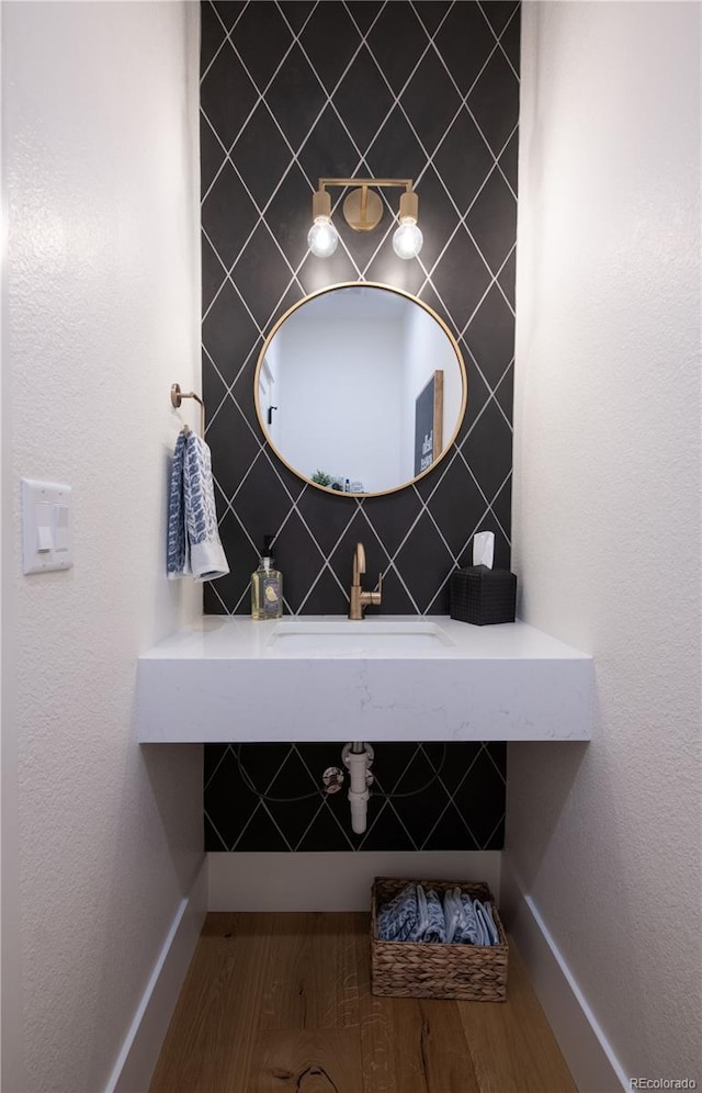 bathroom featuring sink and hardwood / wood-style floors