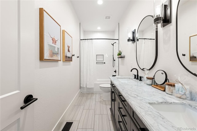 full bathroom with vanity, toilet, and shower / bath combo with shower curtain