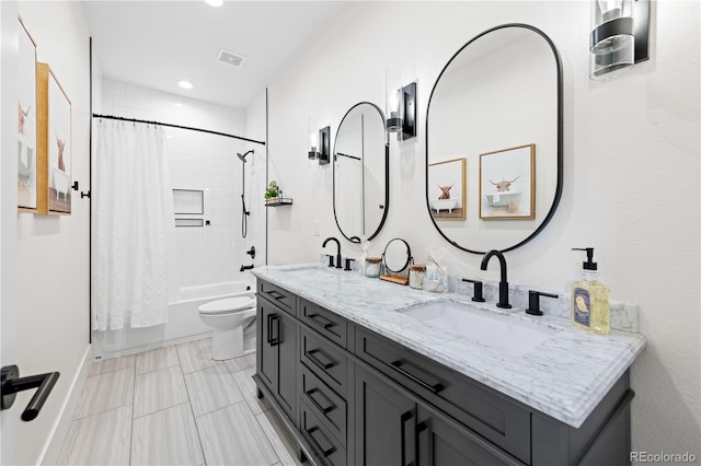 full bathroom featuring toilet, vanity, and shower / bath combo with shower curtain