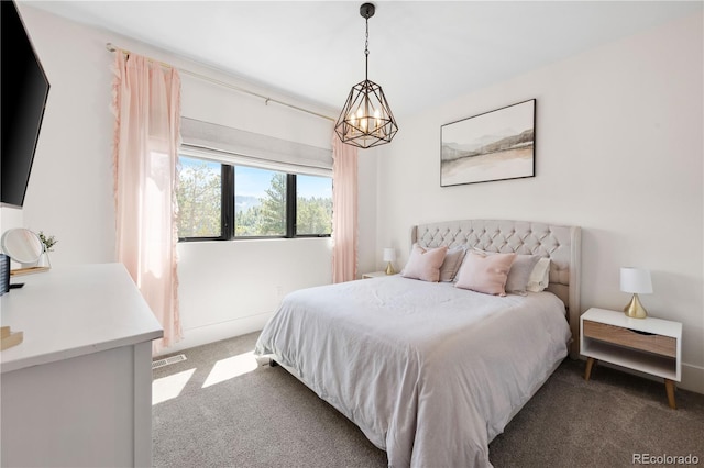 bedroom featuring dark carpet