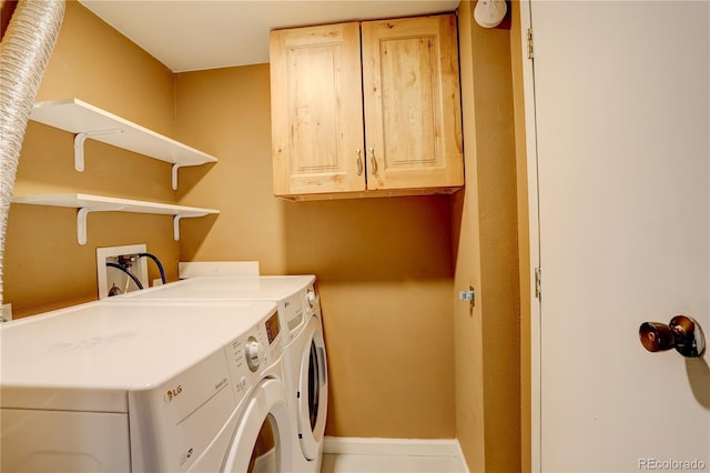 3550 S Harlan St Unit 259, Denver, CO 80235 - laundry room with cabinet space, separate washer and dryer, and baseboards