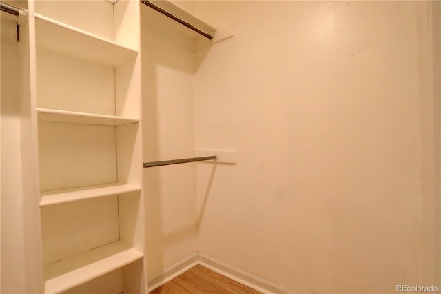 3550 S Harlan St Unit 259, Denver, CO 80235 - walk in closet featuring wood finished floors