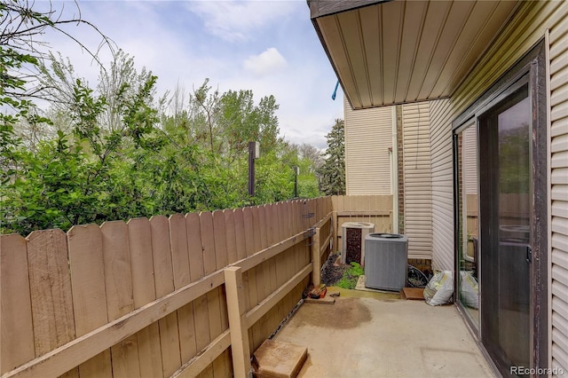 3550 S Harlan St Unit 259, Denver, CO 80235 - view of patio featuring central AC