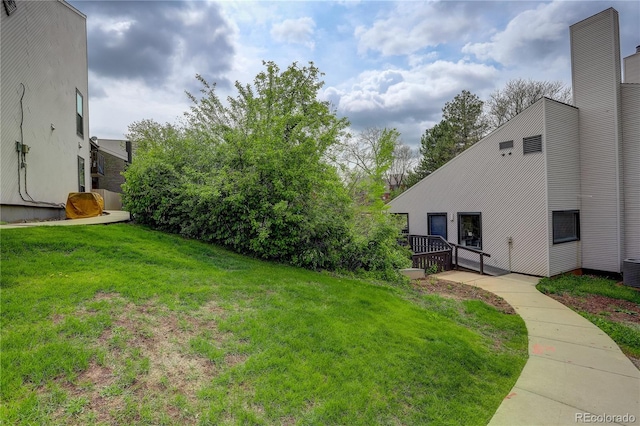 3550 S Harlan St Unit 259, Denver, CO 80235 - view of grassy yard with central AC unit