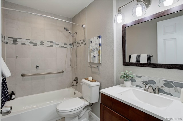 3550 S Harlan St Unit 259, Denver, CO 80235 - bathroom featuring  shower combination, vanity, toilet, decorative backsplash, and a textured wall