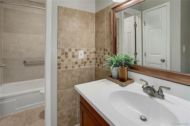 3550 S Harlan St Unit 259, Denver, CO 80235 - full bathroom featuring vanity, toilet, shower / tub combination, and tile walls