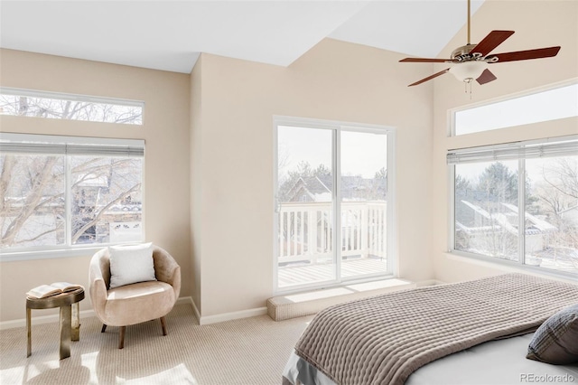 bedroom with access to outside, light colored carpet, and baseboards