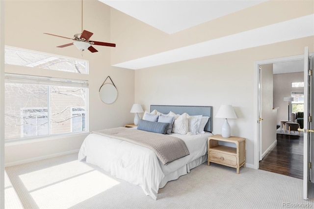 bedroom featuring carpet floors, ceiling fan, and baseboards