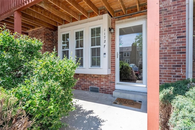 1172 S Zeno Way Unit F, Aurora, CO 80017 - property entrance featuring brick siding and crawl space