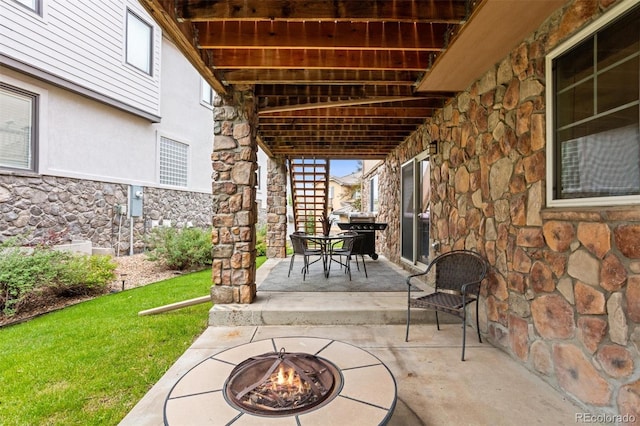 6542 S Tempe St, Aurora, CO 80016 - view of patio / terrace with a fire pit