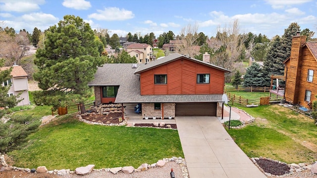 8072 Windwood Way, Parker, CO 80134 - view of front of house featuring fence, an attached garage, concrete driveway, and a front lawn