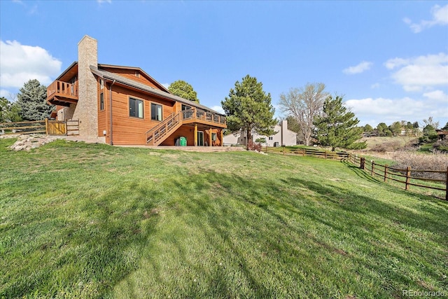 8072 Windwood Way, Parker, CO 80134 - back of house with stairway, a wooden deck, a fenced backyard, and a chimney