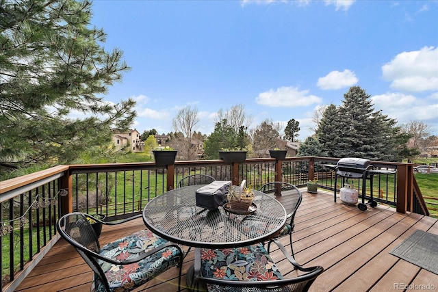 8072 Windwood Way, Parker, CO 80134 - deck with outdoor dining area and a grill