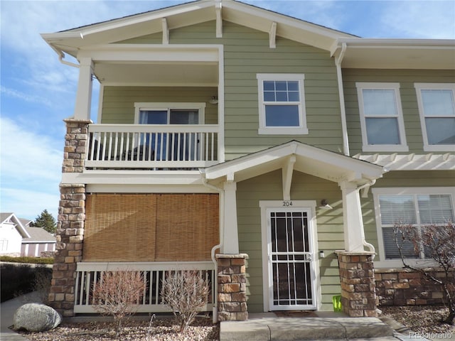 view of front of house with a balcony