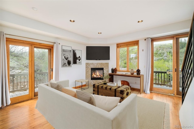 101 Lions Ln, Minturn, CO 81645 - living area featuring a glass covered fireplace, light wood-style flooring, and recessed lighting