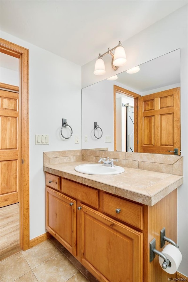 101 Lions Ln, Minturn, CO 81645 - bathroom featuring vanity, baseboards, and tile patterned floors