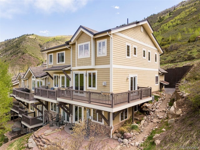 101 Lions Ln, Minturn, CO 81645 - back of property with a deck with mountain view