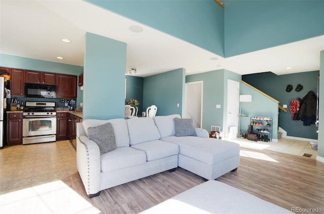 living room with light hardwood / wood-style flooring