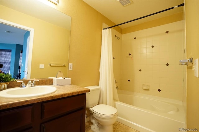 full bathroom featuring shower / bathtub combination with curtain, tile patterned floors, vanity, and toilet