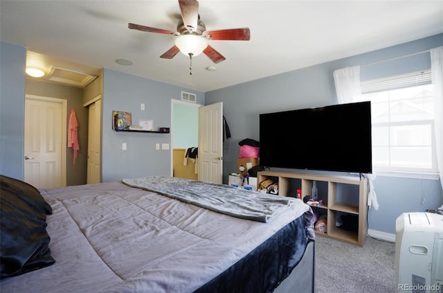 bedroom with multiple windows, carpet floors, and ceiling fan