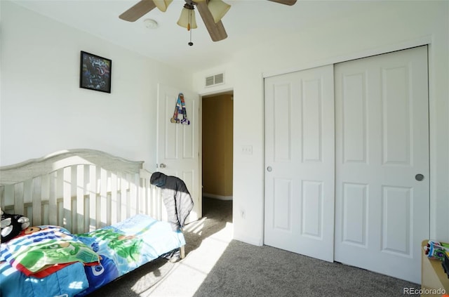 carpeted bedroom with a closet and ceiling fan