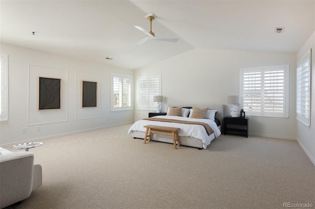 carpeted bedroom featuring lofted ceiling and ceiling fan