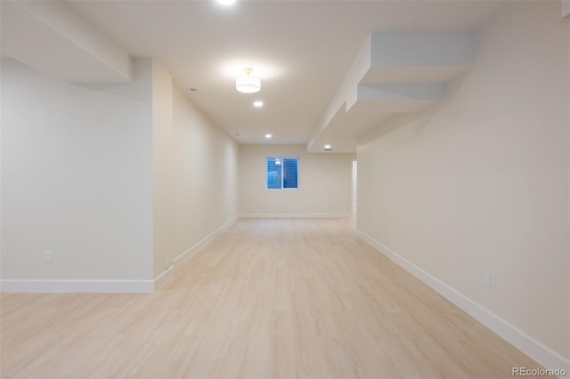 unfurnished room with light wood-type flooring