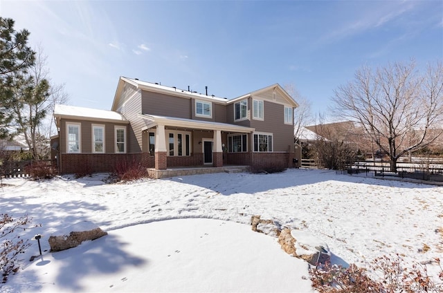 view of snow covered house