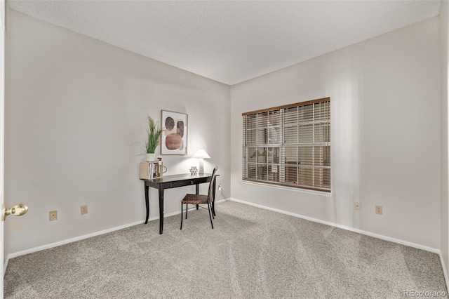 office featuring baseboards and carpet