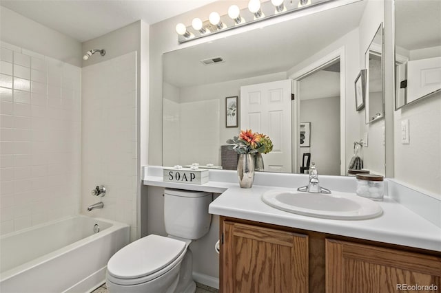 bathroom featuring visible vents, toilet,  shower combination, and vanity