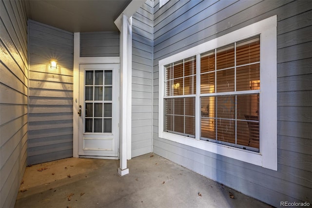 property entrance featuring a patio area