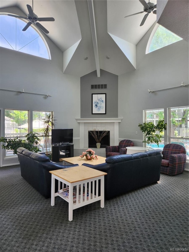 7481 Singing Hills Dr, Boulder, CO 80301 - carpeted living room featuring ceiling fan, high vaulted ceiling, a fireplace, plenty of natural light, and beamed ceiling