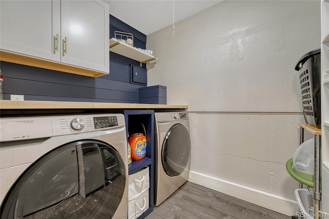 280 Jupiter Dr, Lone Tree, CO 80124 - laundry area with independent washer and dryer, cabinet space, light wood-style floors, and baseboards