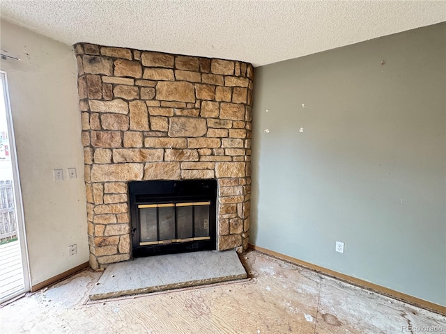 room details featuring a fireplace and a textured ceiling