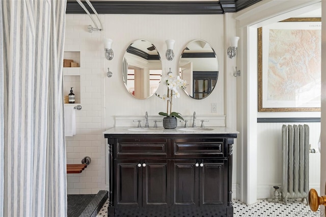 bathroom featuring tile patterned flooring, vanity, radiator heating unit, and ornamental molding