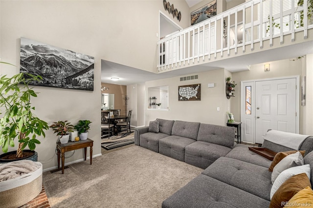7684 S Monaco Cir, Centennial, CO 80112 - carpeted living area with a high ceiling and baseboards