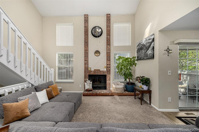 7684 S Monaco Cir, Centennial, CO 80112 - living area with a towering ceiling and a brick fireplace