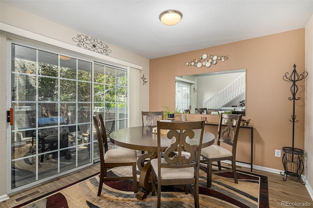 7684 S Monaco Cir, Centennial, CO 80112 - dining space with wood finished floors and stairway