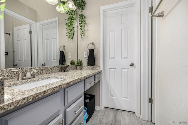 7684 S Monaco Cir, Centennial, CO 80112 - full bath featuring vanity and a chandelier