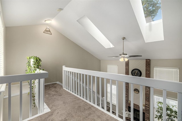 7684 S Monaco Cir, Centennial, CO 80112 - hall with a skylight, lofted ceiling, an upstairs landing, and carpet flooring