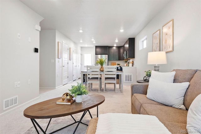 12777 Ulster St, Thornton, CO 80602 - living room featuring light carpet, healthy amount of natural light, and recessed lighting