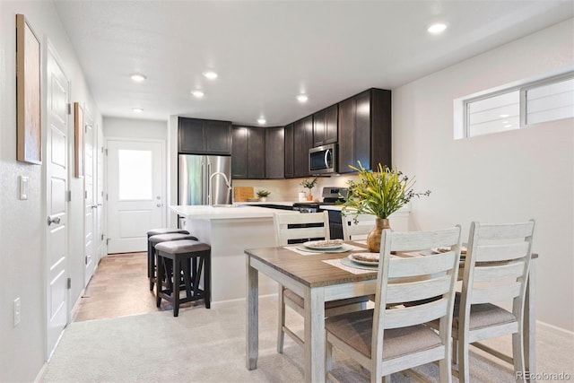 12777 Ulster St, Thornton, CO 80602 - dining room featuring light colored carpet and recessed lighting