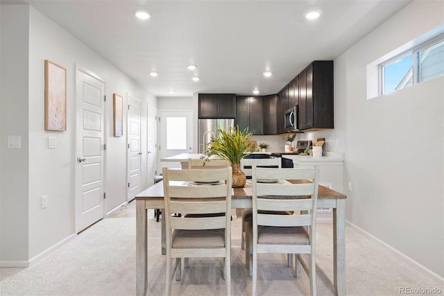 12777 Ulster St, Thornton, CO 80602 - dining space with light carpet and recessed lighting