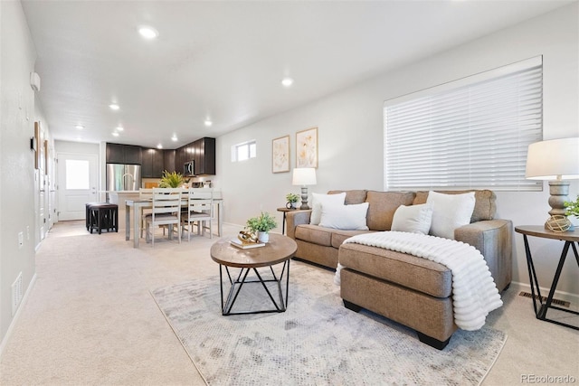 12777 Ulster St, Thornton, CO 80602 - living area with light colored carpet and recessed lighting