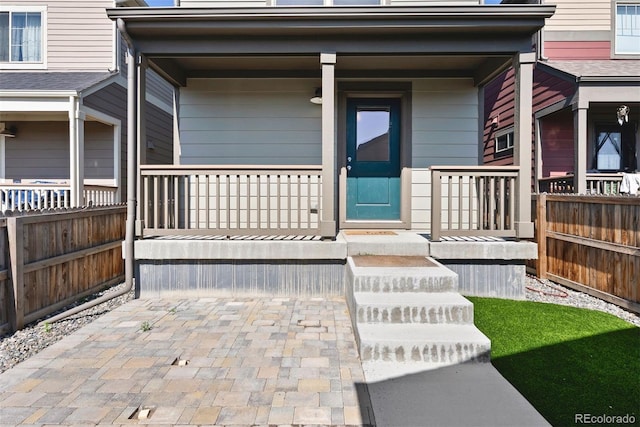 12777 Ulster St, Thornton, CO 80602 - doorway to property featuring a porch